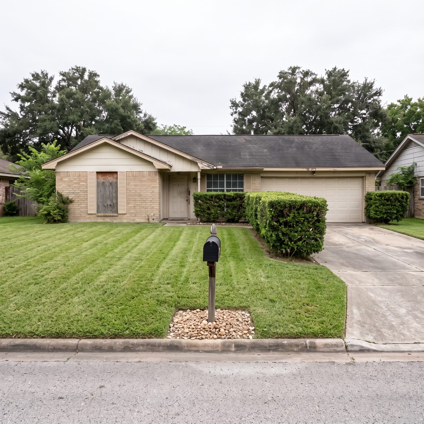 The same lawn mowed and edged after